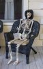 human-skeleton-sitting-chair-american-porch-halloween-style-61941487.jpg